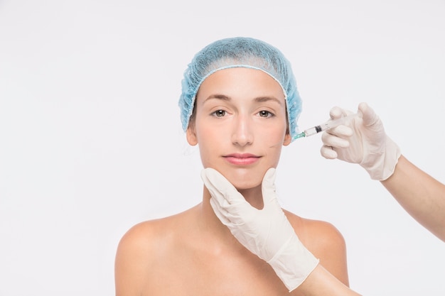 woman getting injection in face
