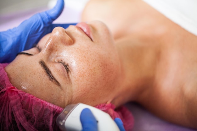 Woman getting LPG hardware massage at the beauty clinic