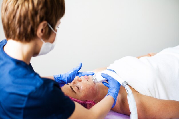 Woman getting massage at the beauty clinic