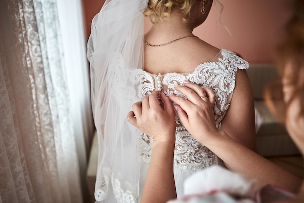 Woman getting ready before wedding ceremony