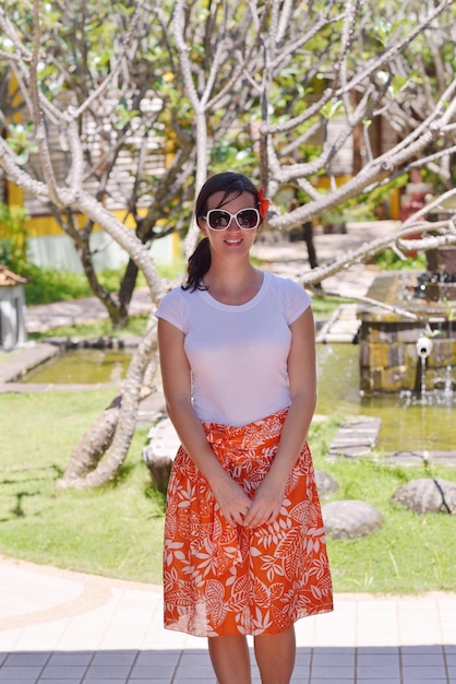 Woman getting spa treatment at tropical resort