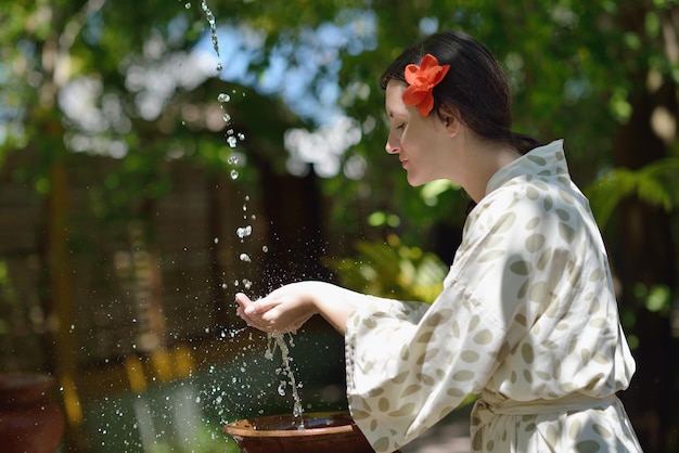 Woman getting spa treatment at tropical resort