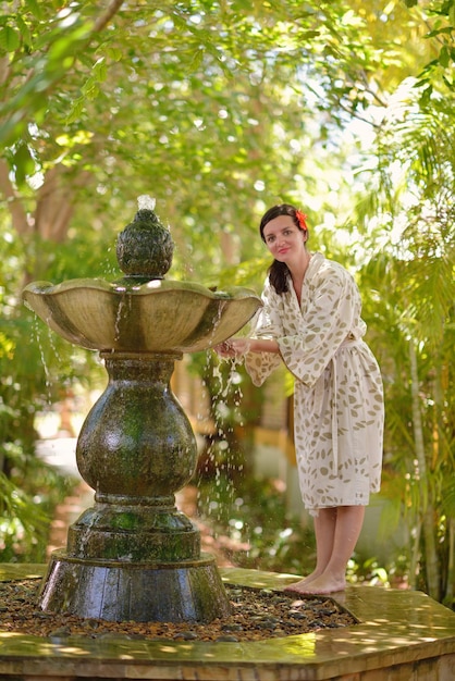 Woman getting spa treatment at tropical resort