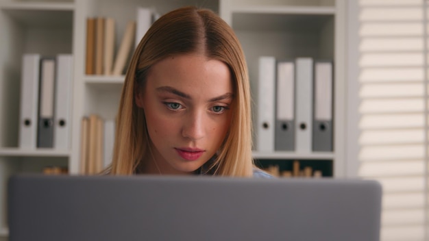 Woman girl business accountant businesswoman using laptop at home office confused dissatisfied with