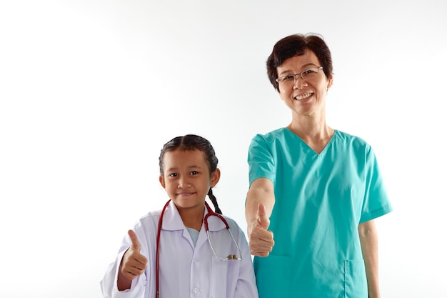 Woman and girl in doctor costumes chatting