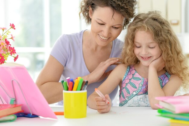 Woman and girl drawing