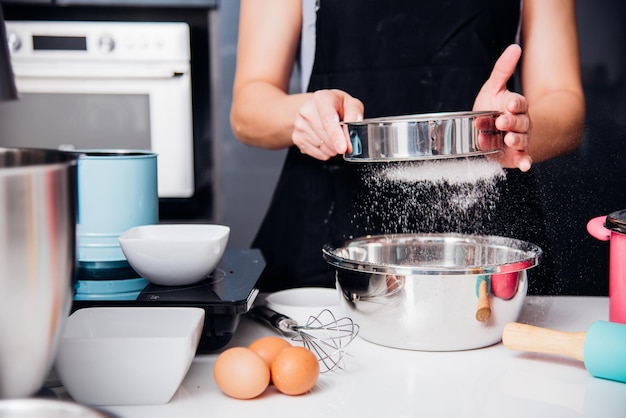 Woman girl in kitchen cooking baker bakery powder dough