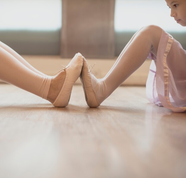 Woman and girl practising ballet 