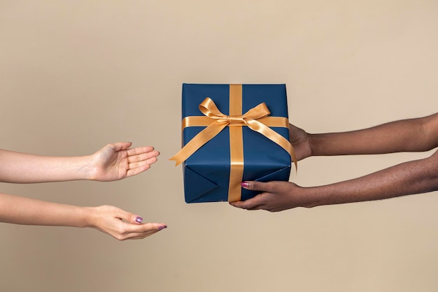 Woman giving a present to her friend