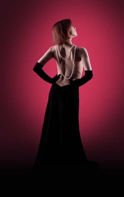 Woman glamour portrait in red dark