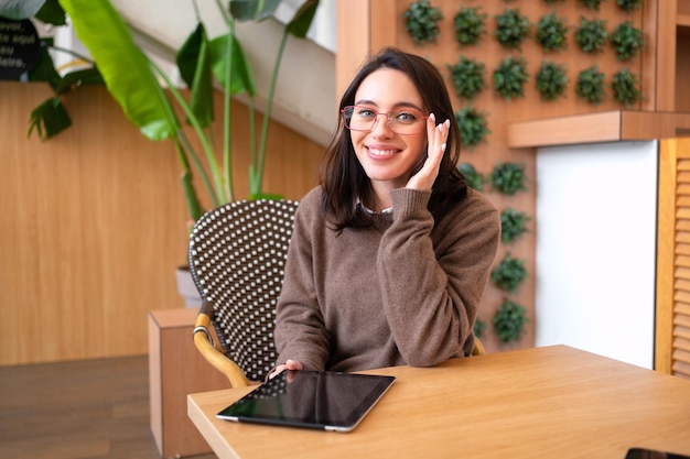 Woman in glasses with tablet computer