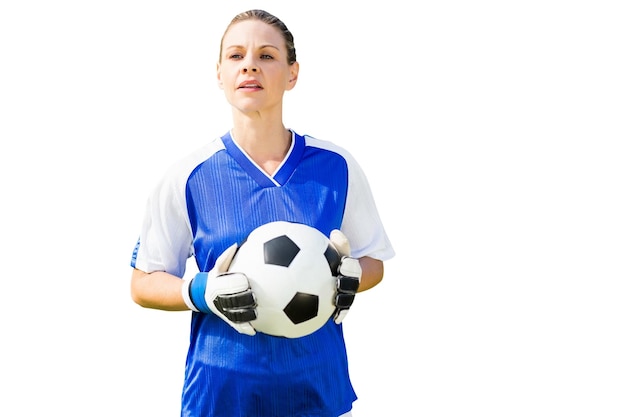 Woman goalkeeper posing with a ball