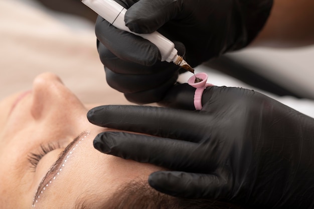 Photo woman going through a microblading treatment