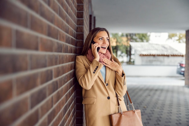 A woman gossiping on the phone