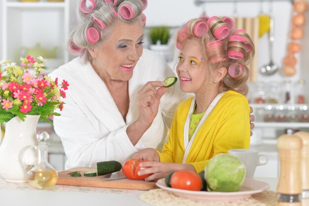 Woman and granddaughter at kitchen