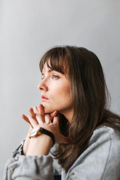 Woman in a gray long sleeve shirt