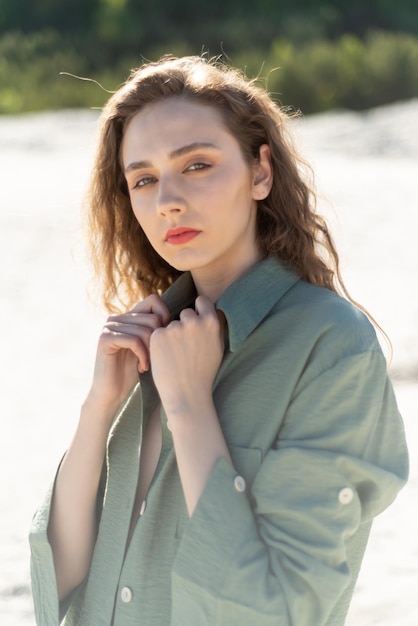 A woman in a green shirt and a shirt