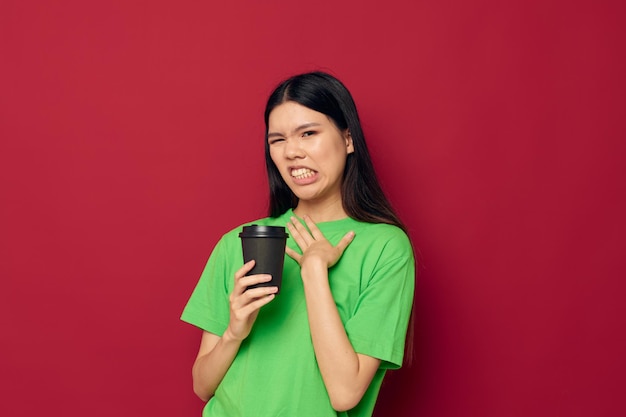 Woman in green tshirt black glass posing