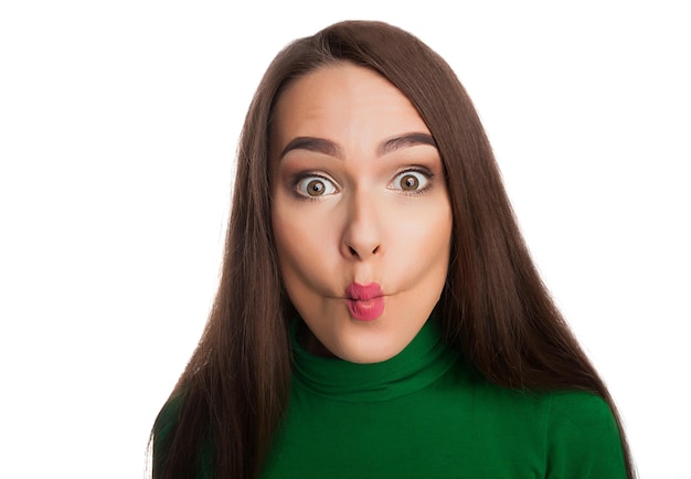 Woman in a green turtleneck showing emotions and feelings