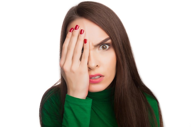 Woman in a green turtleneck showing emotions and feelings