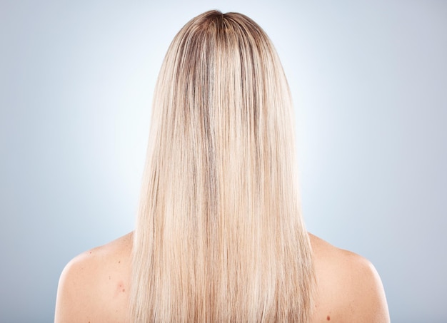 Woman hair and back of a blonde woman with keratin treatment hairstyle or hair care Beauty salon blond hair and hair style or haircare of a lady with healthy beauty and long healthy hair