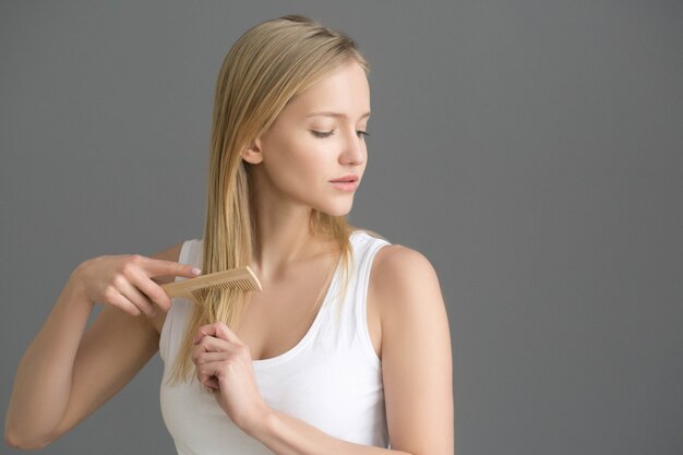 Woman hair comb. Problems with hair. Studio shot.