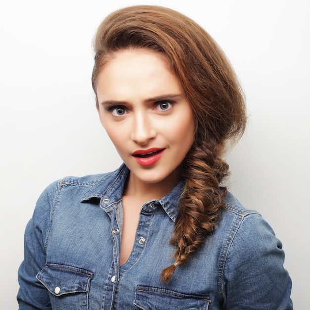 Woman hair style portrait.Close up over white background.