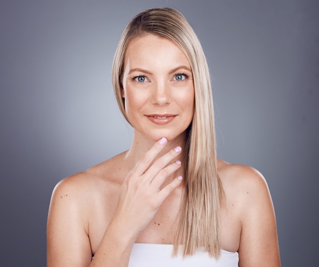 Woman hair wellness and beauty portrait for salon growth luxury cosmetics care and dermatology keratin treatment in grey studio background Model face skincare glow motivation and hair care shine