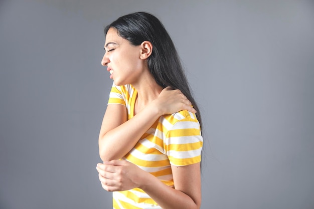Woman hand in ache shoulder