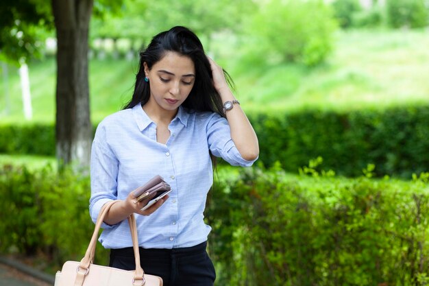 Woman hand bag and wallet in street