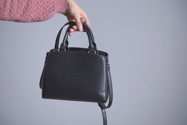 Woman hand black bag