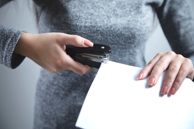 Woman hand brace and papers