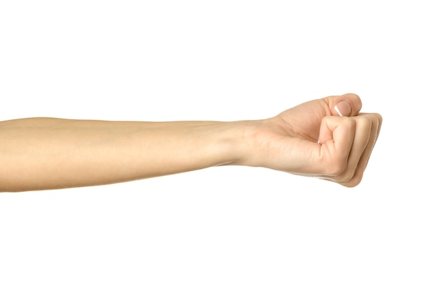 Woman hand clenched in a fist on white