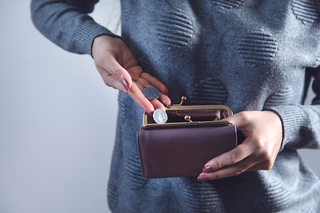 Woman hand coin with wallet