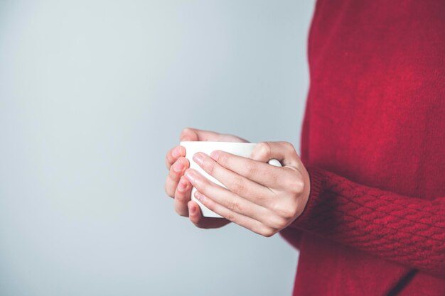 Woman hand cup of coffee and tea