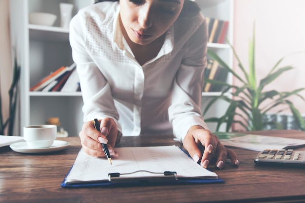 Woman hand document and calculator