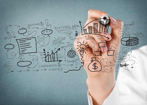 woman hand drawing business plan isolated on background
