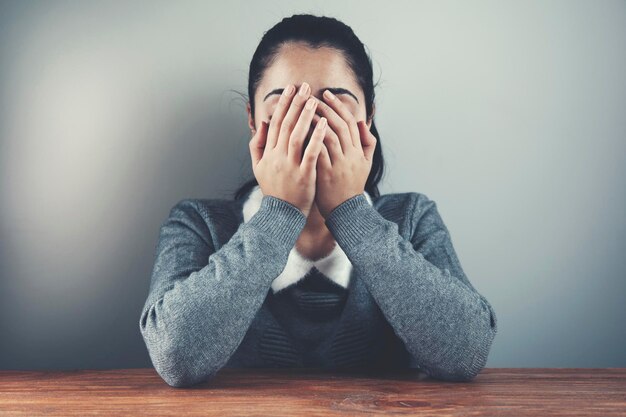 Woman hand in face