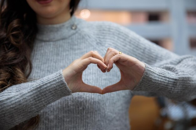 Woman hand heart sign