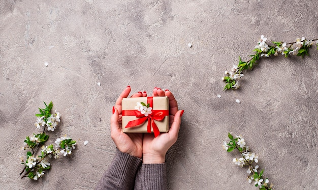 Woman hand hold gifts boxes. 