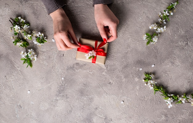 Woman hand hold gifts boxes.