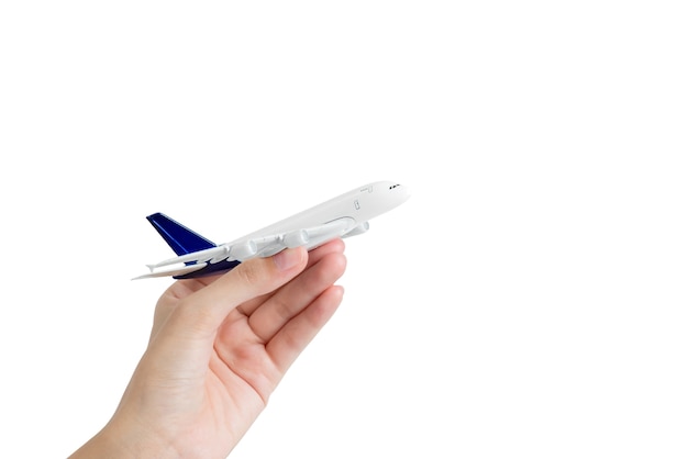 Woman hand holding airplane model- transport industry concepts