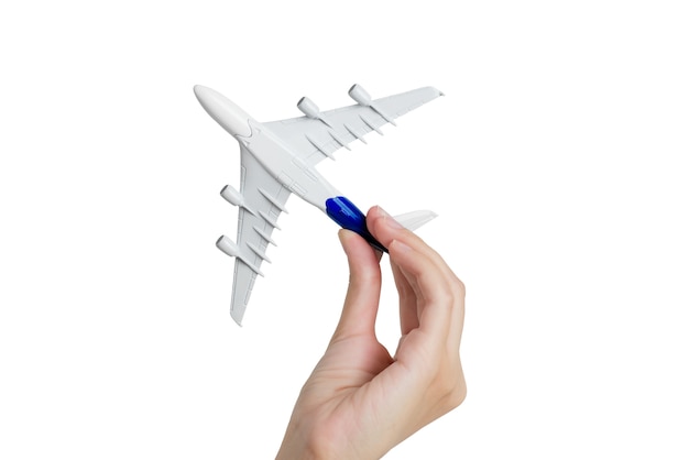 Woman hand holding airplane model