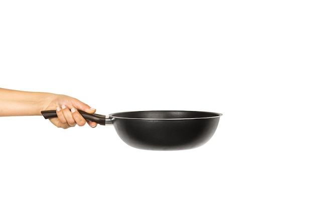 Premium Photo | Woman hand holding a black frying pan on a white ...