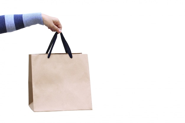 Woman hand holding blank shopping bag on white