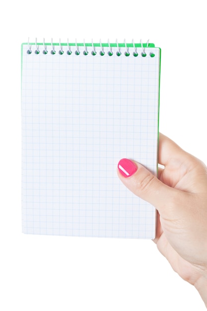 Woman Hand Holding Blank Spiral Notepad on a white background.