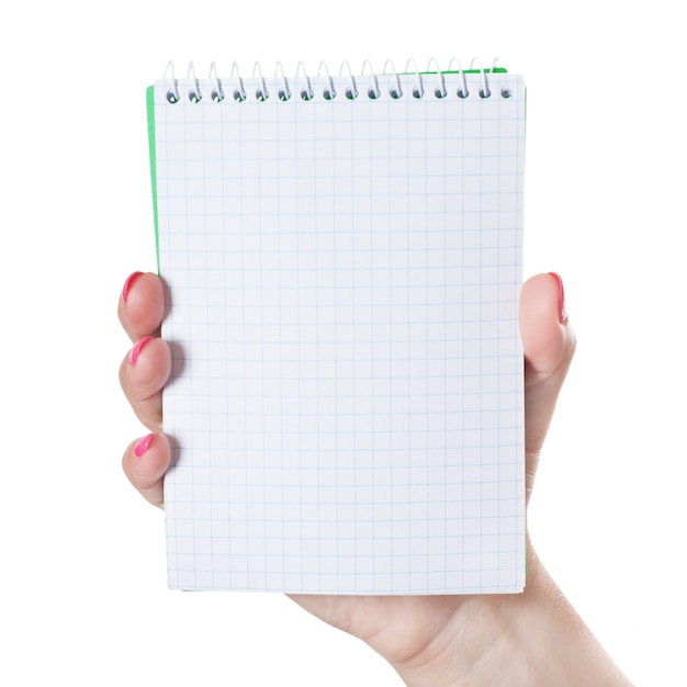 Woman Hand Holding Blank Spiral Notepad on a white background.