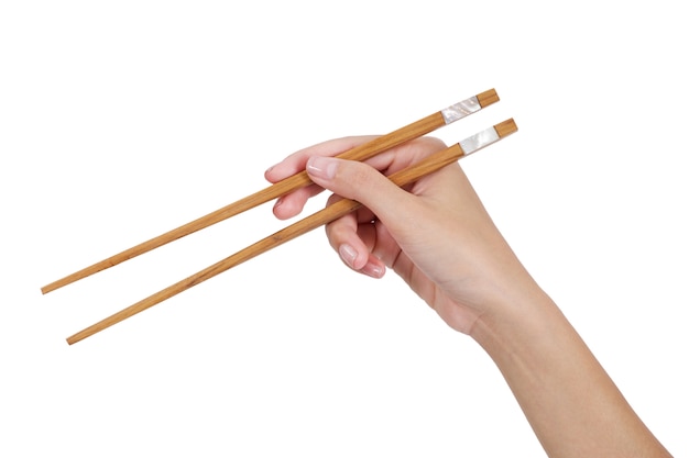 Woman hand holding chopsticks isolated on white