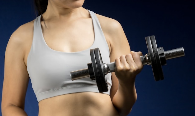 Woman hand holding dumbbell for work out