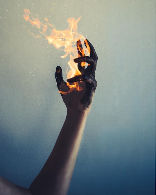 woman hand holding fire